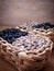 Two wicker baskets.  Each basket contains half sunflower seeds and half peeled sunflower seeds