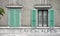 Two windows and green shutters
