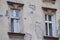 Two Windows in an old house before repair or reconstruction, fallen plaster, old wooden frames. randomly hang sa electricity