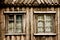 Two windows in a wooden cottage