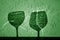 Two wine glasses shadow in green tone