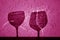 Two wine glasses shadow in pink tone