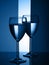 Two wine glasses silhouette full on blue background. Trendy color of the year 2020