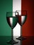 Two wine glasses silhouette full on italian flag background. Alcohol beverage