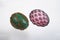 Two wired Easter eggs green and pink isolated