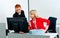 Two woman colegues working on computer in office