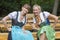 Two woman in dirndl with pretzel