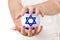 Two Woman Hands Protecting Israel Flag Earth Globe Sphere.