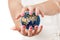 Two woman hands protecting planet earth world globe. Elements of this image furnished by nasa. 3d rendering