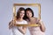 Two woman inside a picture frame