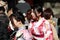 Two woman in Kimono dress among traveller at Japanese Shrine.