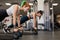 Two woman training in gym, elevated raised push ups with kettlebells