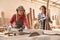 Two women as carpenter apprentices at the circular saw