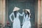 Two women beautiful wearing Ao Dai Vietnamese traditional dress
