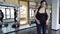 Two women in black sportswear doing aerobics with special benches in gym.