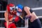 Two women boxing in the ring.