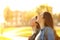 Two women breathing fresh air in a park at sunset