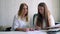 Two women business partner sign a contract. Business concept