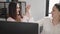 Two women business workers using computer high five at office