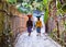 Two women carry on their heads basket with watermelons in San M