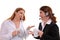 Two women chatting with wearing headsets