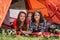 Two women and child at camping tent