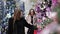 Two women choose the scenery for the Christmas store Christmas decorations.