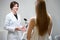 Two women communicate in a gynecological office