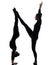 Two women contortionist exercising gymnastic yoga silhouette