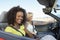 Two Women In Convertible On Desert Road