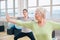 Two women doing stretching and aerobics workout