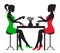 Two women drinking coffee at a table