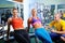 Two women exercise with personal fitness trainer