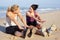 Two Women Exercising On Beach