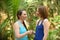 Two women expressing a truce or greeting by shaking hands