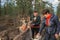 Two women feed reindeer, Sami, saami village on the Kola Peninsula, Russia. Tourist ethnographic parking. Settlement Old Titovka,