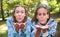 Two women friends blowing kiss to camera