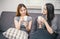 Two women friends having conversation and drinking coffee