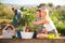 Two women gardeners satisfied with rich harvest