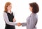 Two women give handshake after agreement