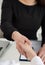 Two women handshake in office closeup