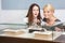 Two women looking at showcase with jewelry