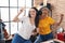 Two women musicians listening to music dancing at music studio