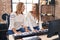 Two women musicians playing piano at music studio