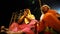 Two women perform worship during Ganga Aart