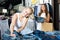 Two women picking new pair of jeans in fashion department