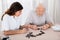 Two Women Playing Domino Game In Hospital