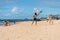 Two women playing frescobol a kind of beach tennis at Itapua beach