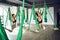 Two women practices different inversion antigravity yoga