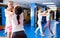 Two women practicing palm strike in sparring in gym